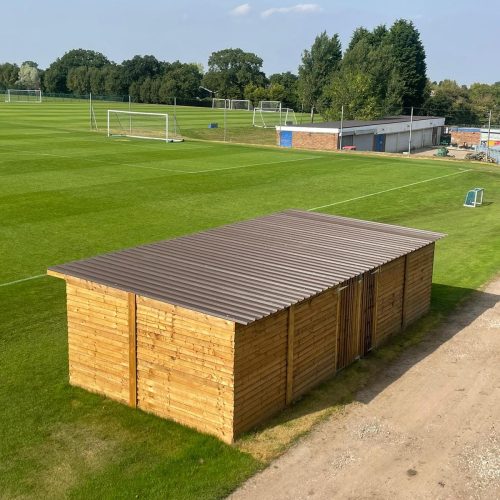 A large outdoor wooden structure built by Wise Roots