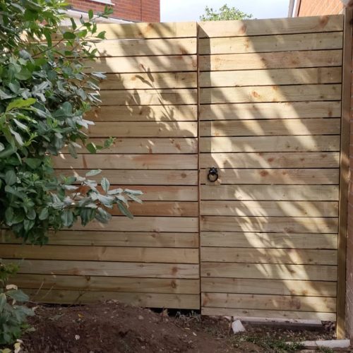A bespoke wooden fence built by Wise Roots