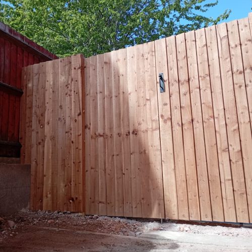 A bespoke wooden fence build by Wise Roots